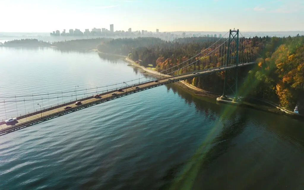 Lions Gate Bridge crossing into Stanley Park with downtown Vancouver beyond